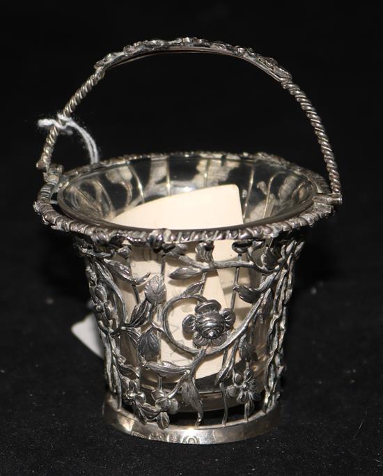 A George III silver cream pail, pierced with floral design, London 1768, William Vincent (base a.f), with clear glass liner